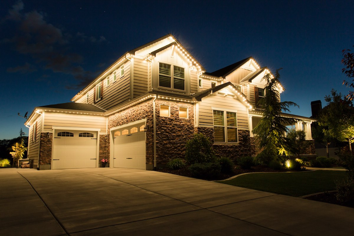 Beautiful home with permanent roofline lighting